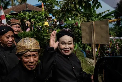 Edi Purnomo, right, at a festival in Tegeswetan, Aug. 27, 2016.